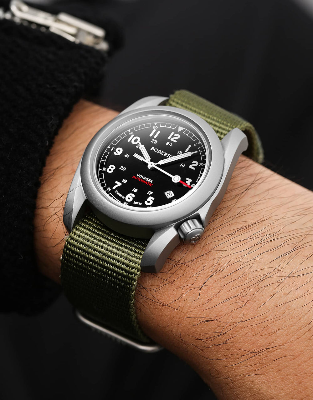 Black Boderry Voyager field watch on a green nylon strap in official brand photography
